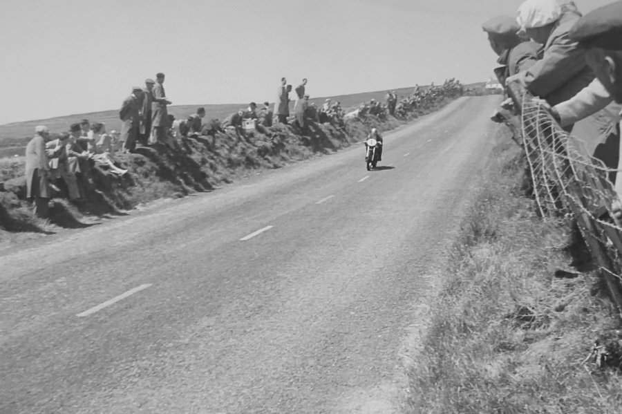 Geoff Duke (#1), the winner of the 1951 TT, riding down from Kate's Cottage towards Creg-ny-Baa